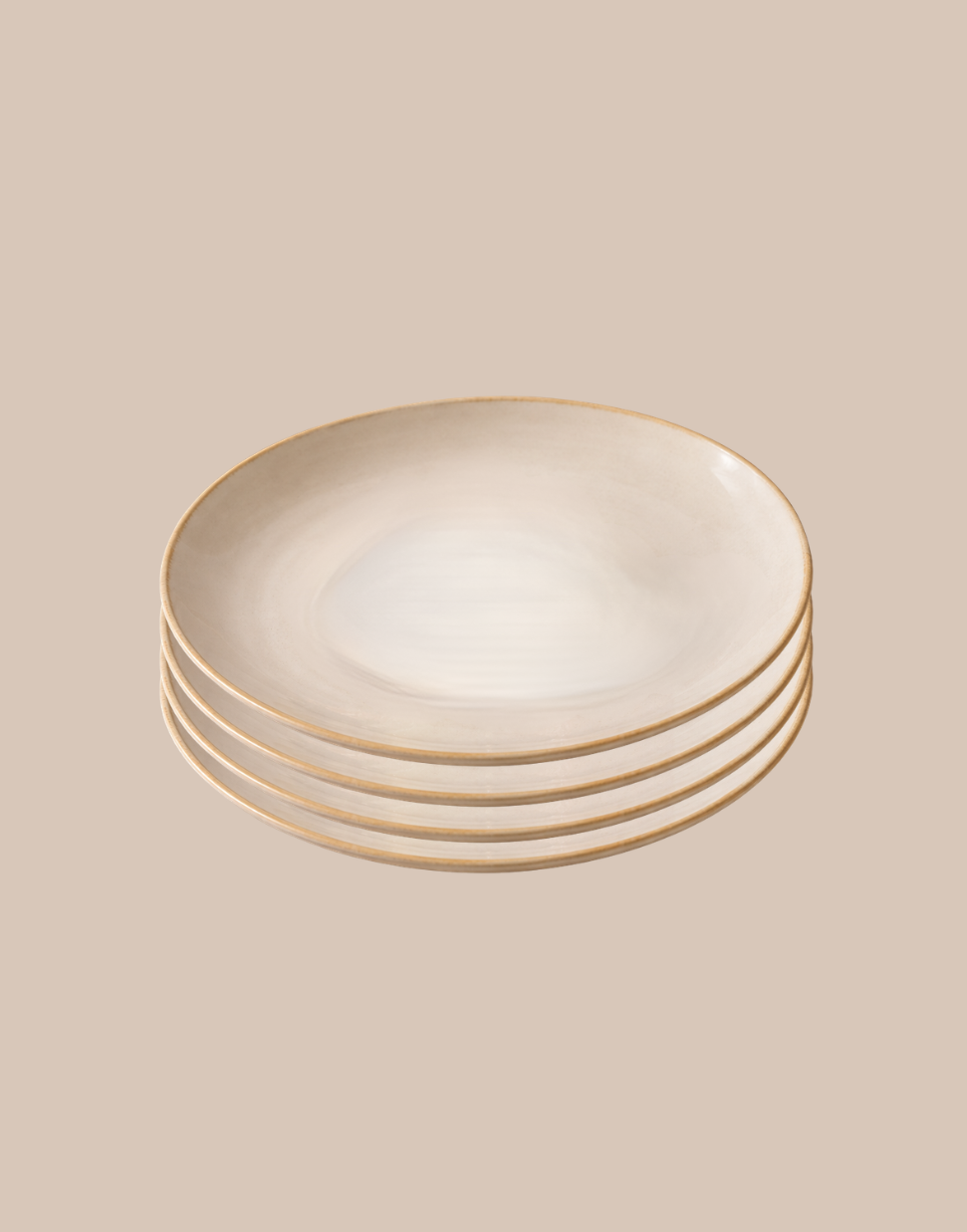 A stack of five round ceramic plates with a warm cream center and a thin gold rim, set against a solid beige background.